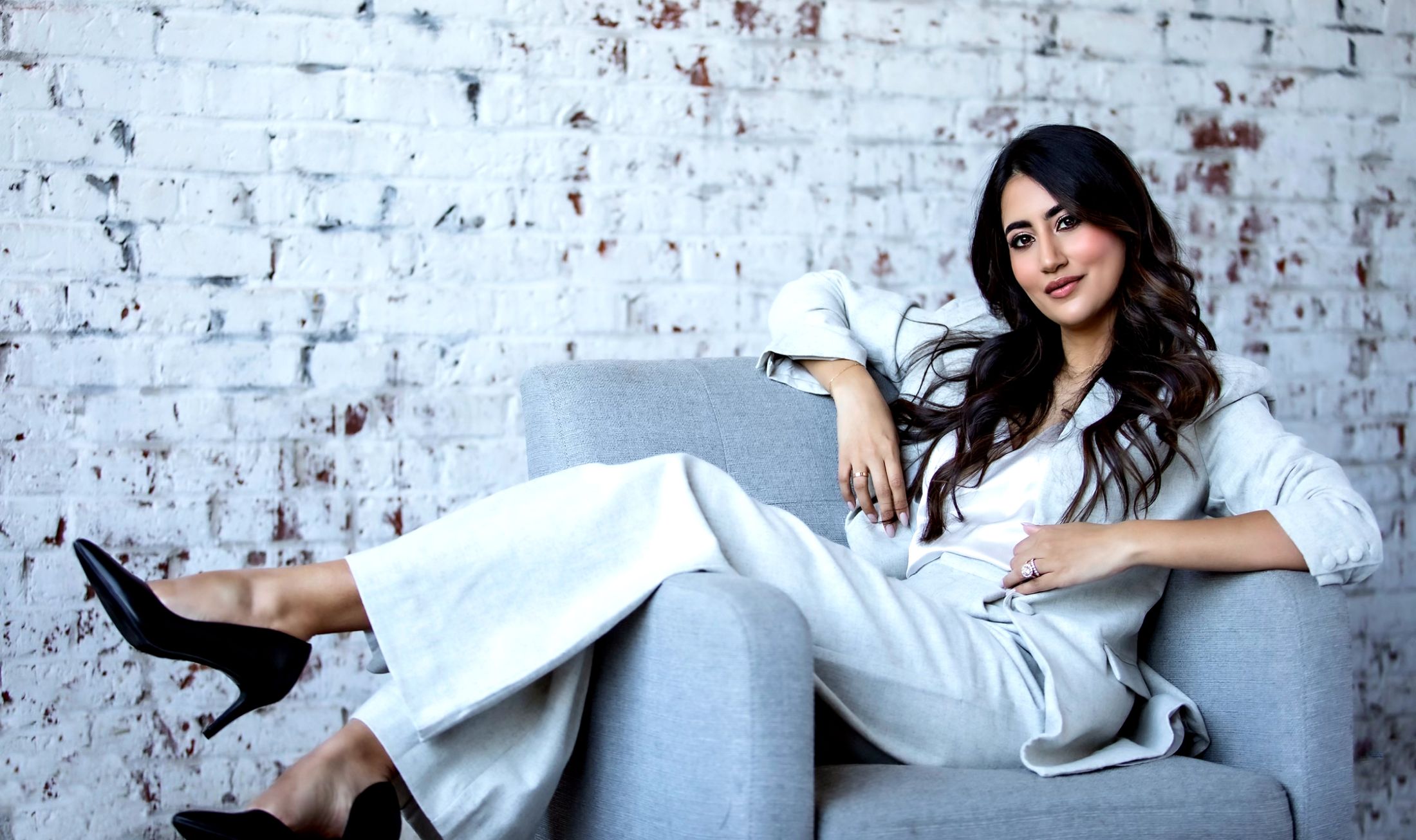 Karishma Lakhani sitting in a chair